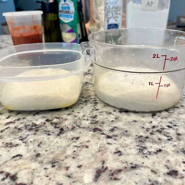 Proofed dough in containers ready to be shaped