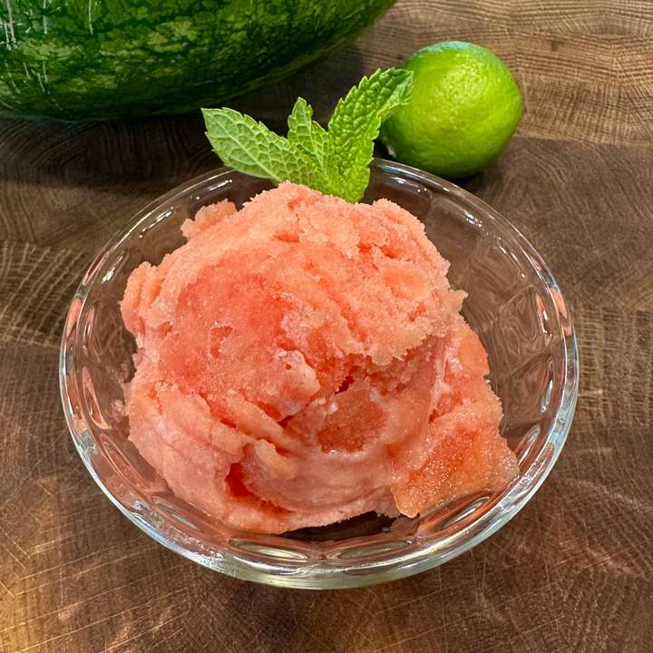 Watermelon lime sorbet finished and scooped into a bowl